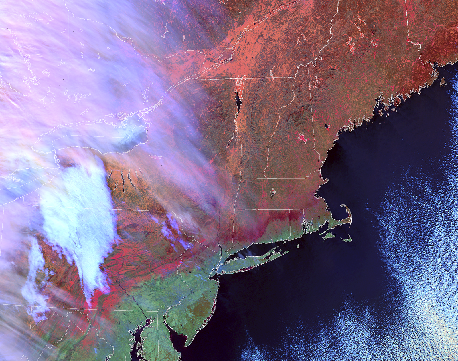 An infrared image of the northeastern United States, including Connecticut, in shades of red and green. A white cloud covers the westernmost part of the image.