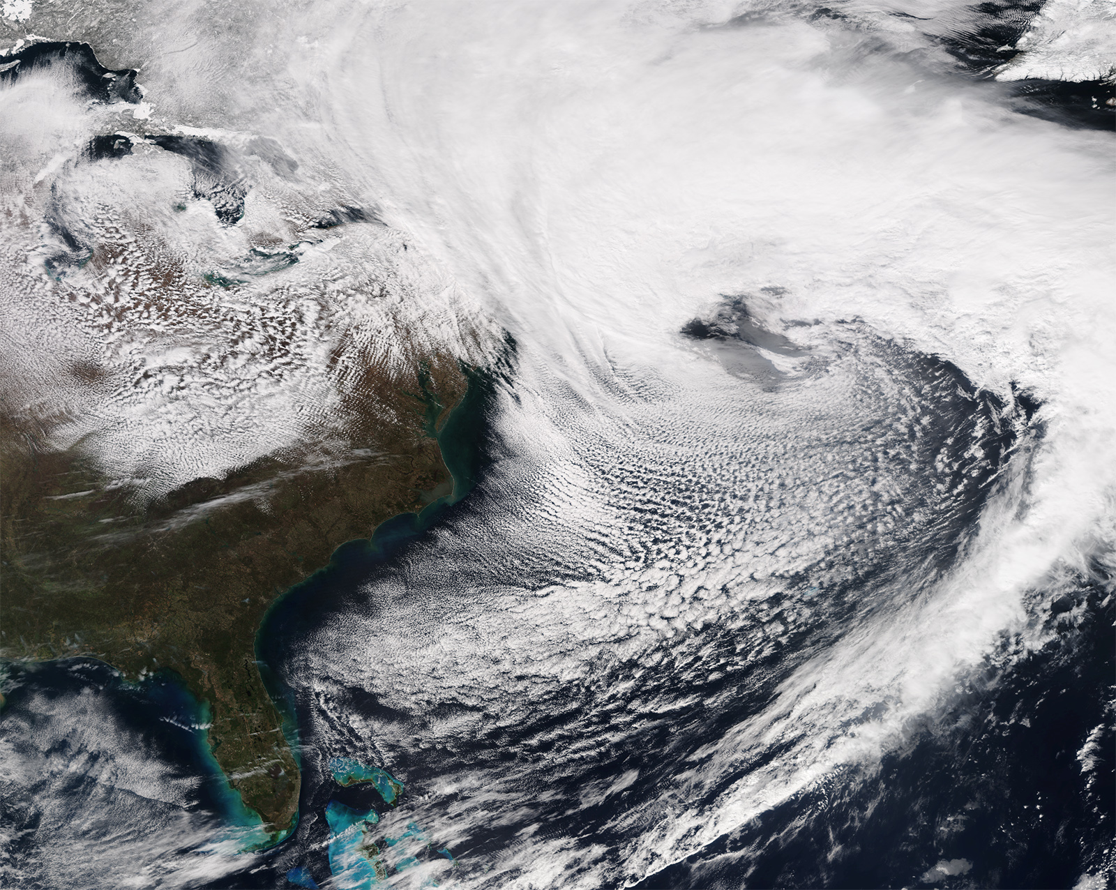 In a true-color satellite image of the eastern U.S., clouds from a snowstorm cover the majority of the northeast, from Maryland all the way up the coast.