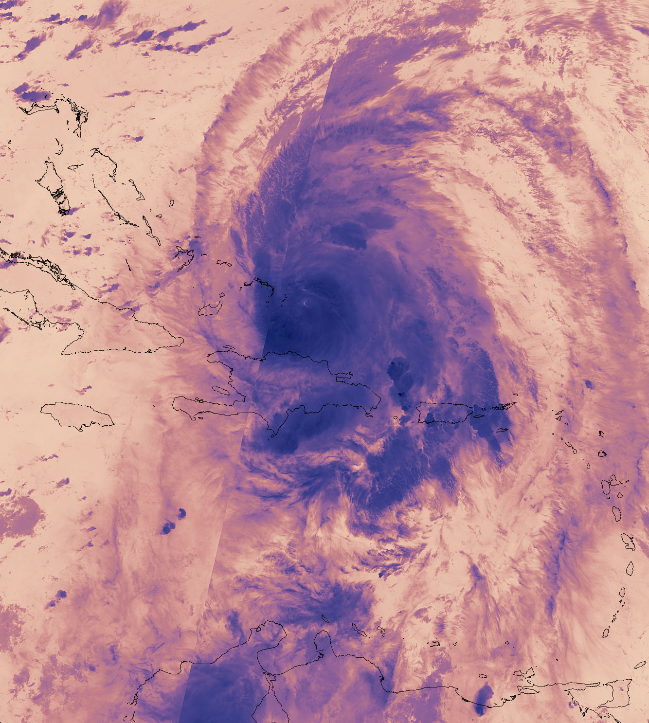 An infrared image of Hurricane Maria shows the storm in shades of pink and deep blue. The blue in the eye of the hurricane, just east of the U.S. Virgin Islands, indicates the highest, coldest clouds.