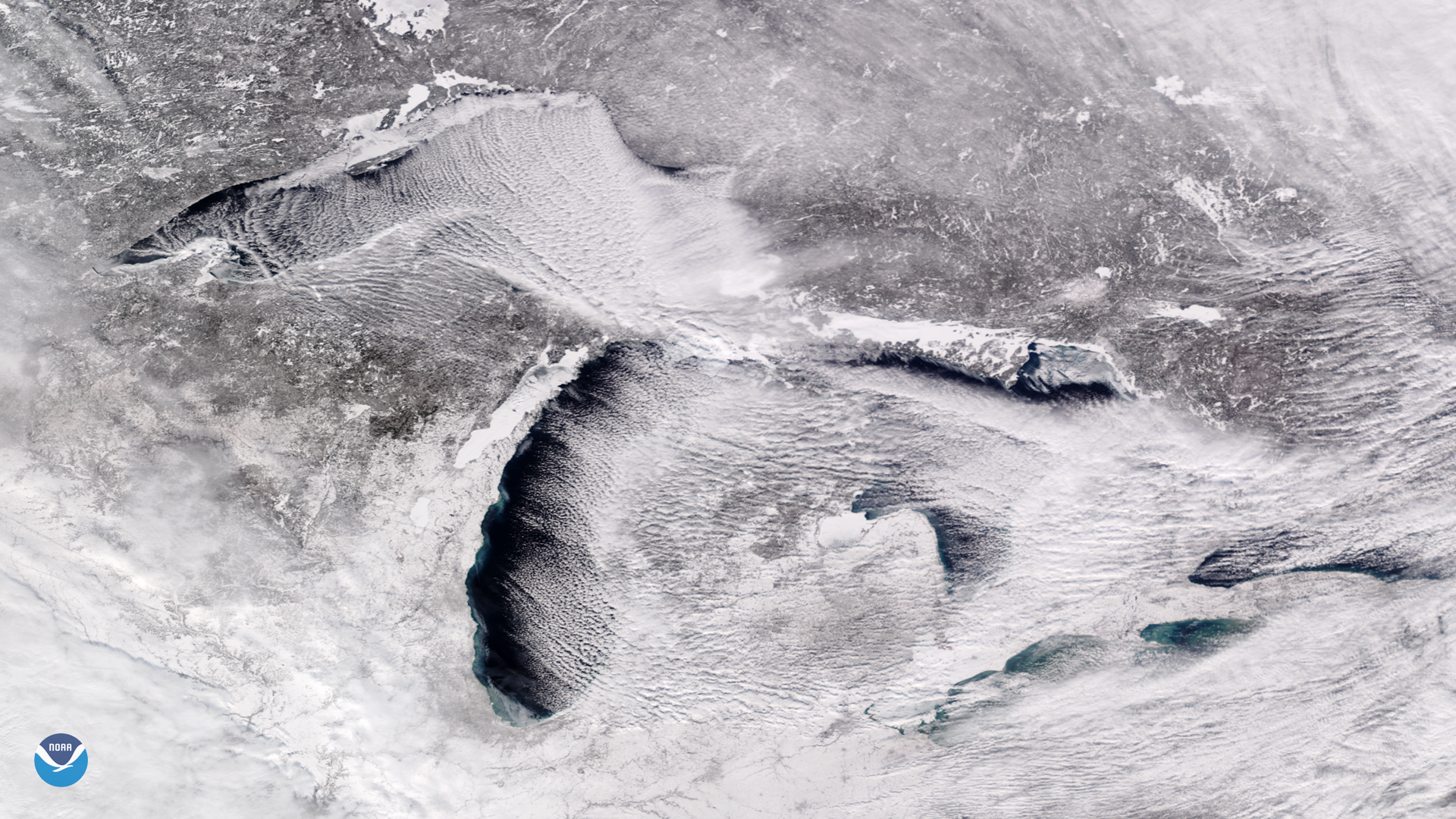 Frigid air and cloud streets stream across the Great Lakes