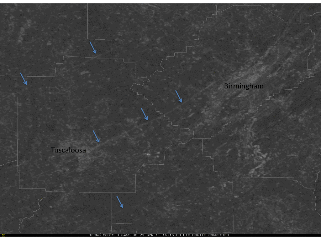 Another view of damage paths through central Alabama (blue arrows) across Alabama from late morning on April 29, 2011, as seen from NASA’s Terra MODIS. 