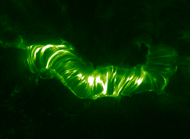 A green and black depiction of the solar magnetic arcade.