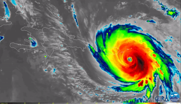 Large, multicolored swirl of hurricane Maria, is seen over open water approaching Puerto Rico