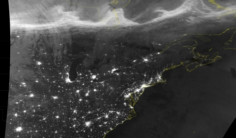 Satellite image showing the aurora borealis over North America in VIIRS' Day Night band.