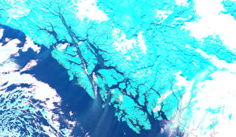 Satellite image over water channels in southeast Alaska shows sea spray from winds.
