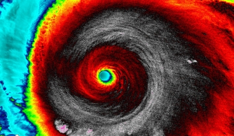 Enhanced color satellite image of an eye of a hurricane.