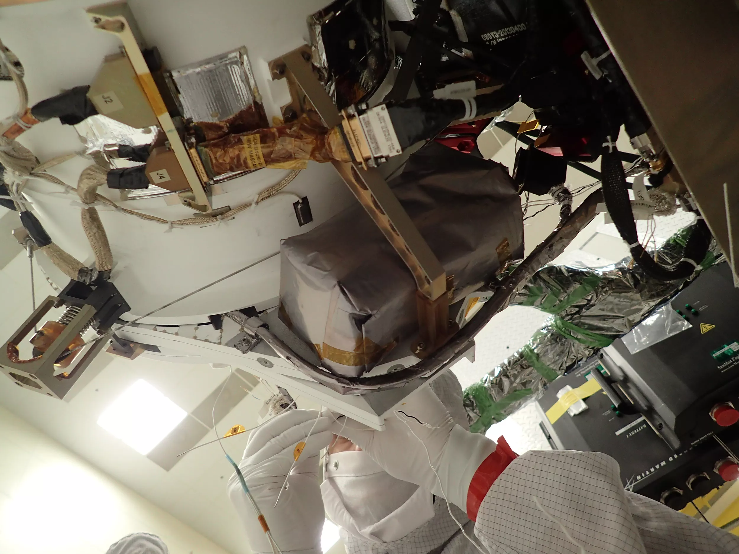 Image of A technician works to install GMAG on the GOES-T spacecraft.