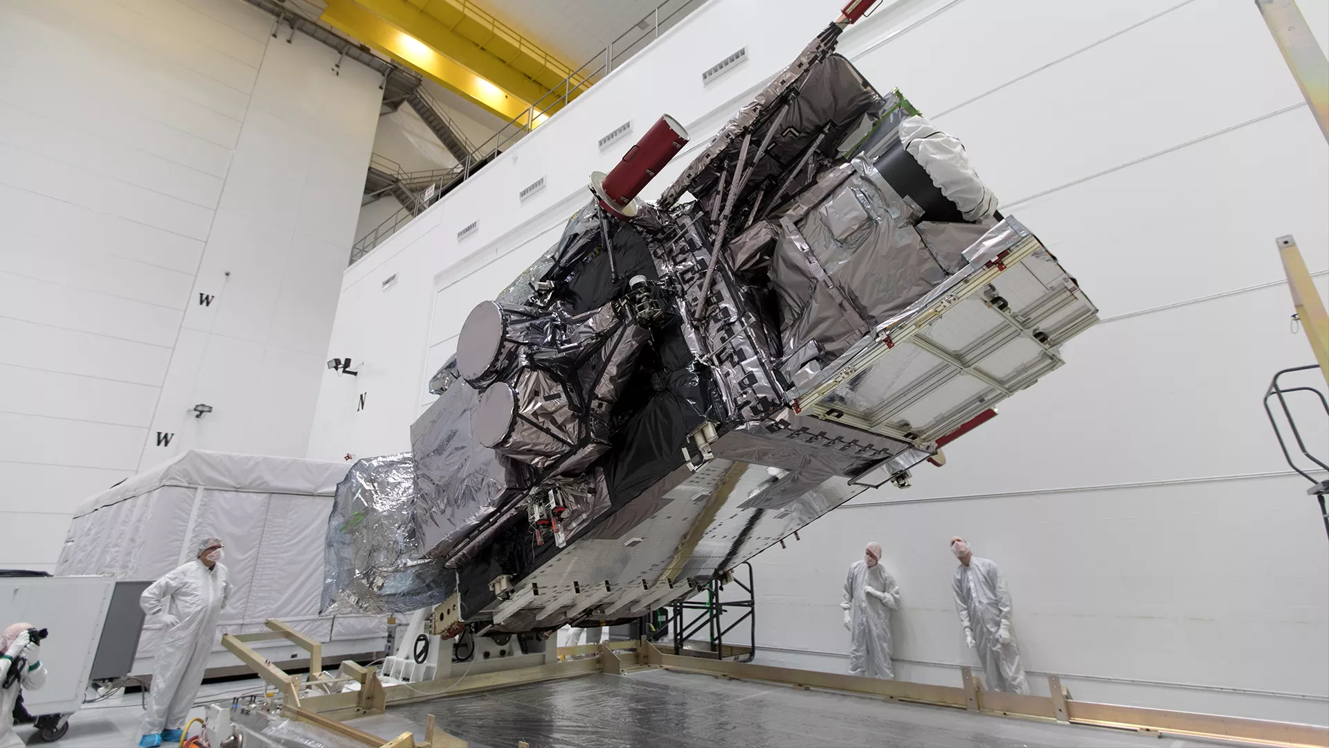 NOAA's GOES-S satellite is rotated to the vertical position after uncrating at Astrotech Space Operations in Titusville, Florida, so engineers can prepare the satellite for a March 2018 launch.