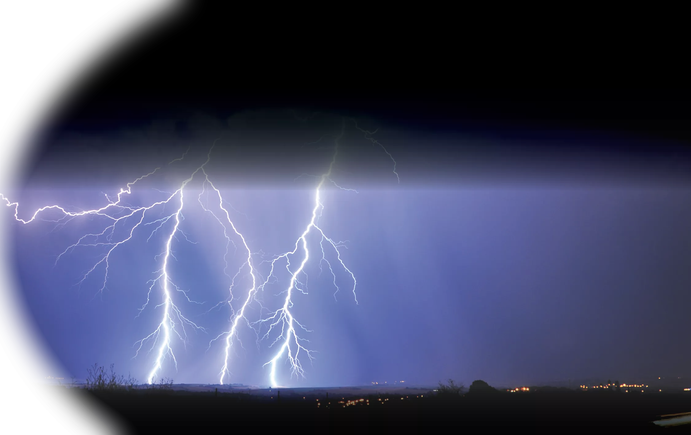 Lightning strikes in the night sky