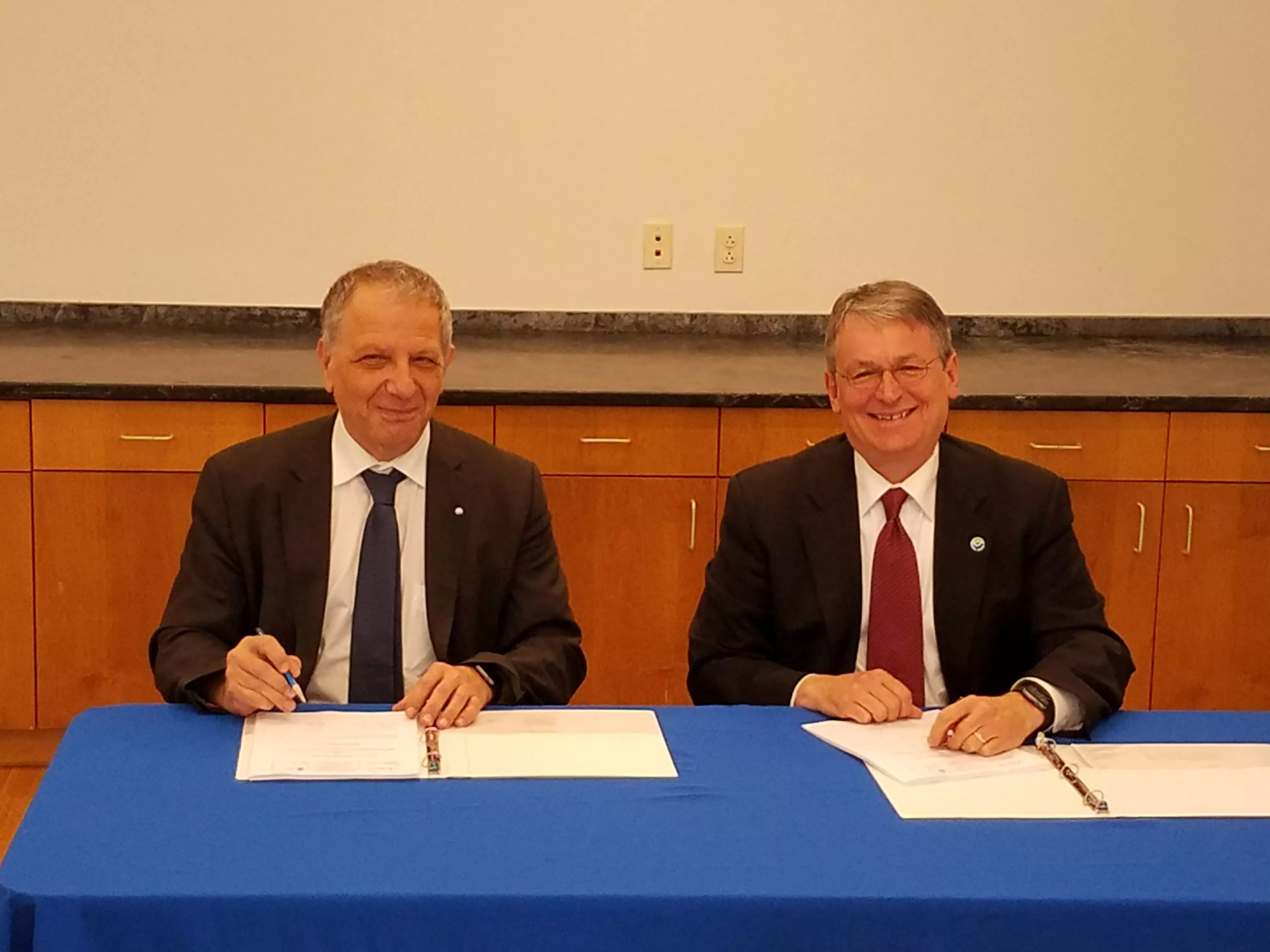Marc Cohen, EUMETSAT Associate Director for LEO Programmes, and Harry Cikanek, former director of JPSS, sign the Joint Polar System Program Implementation Plan on December 15, 2016.
