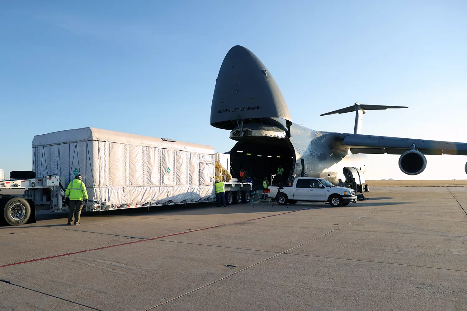 GOES-T being loaded onto a C-5M Super Galaxy aircraft that will fly it to the Kennedy Space Center in Florida.