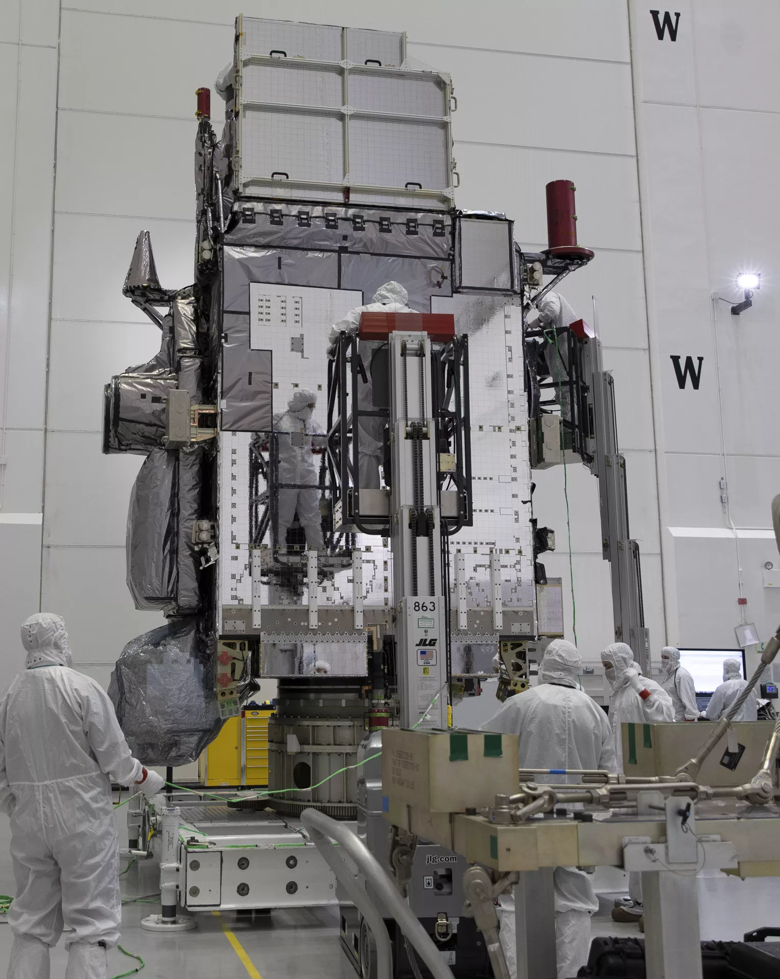 GOES-T is propped up to be more closely inspected.