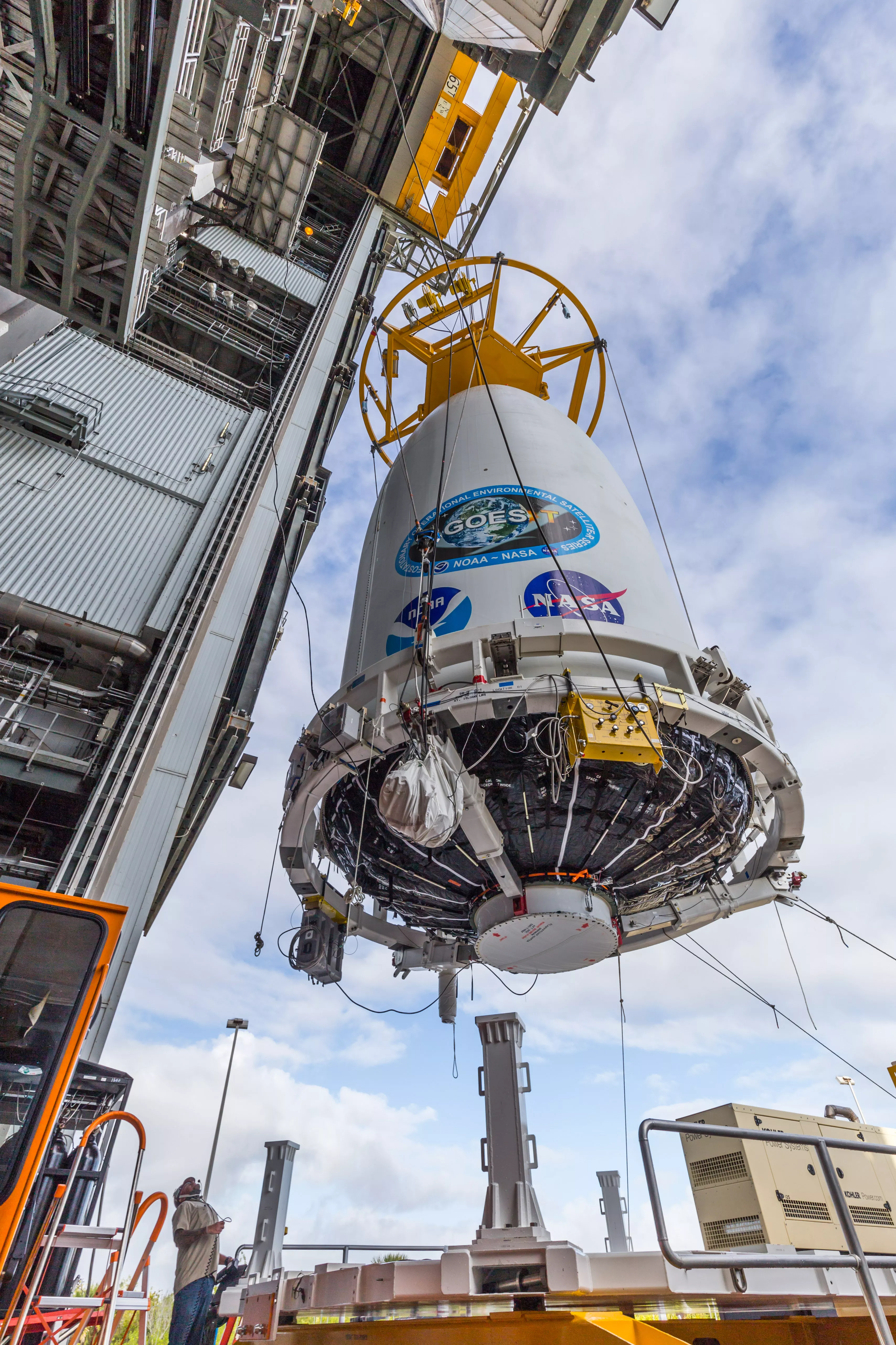 Crane Lifts GOES-T for Mate to Launch Vehicle