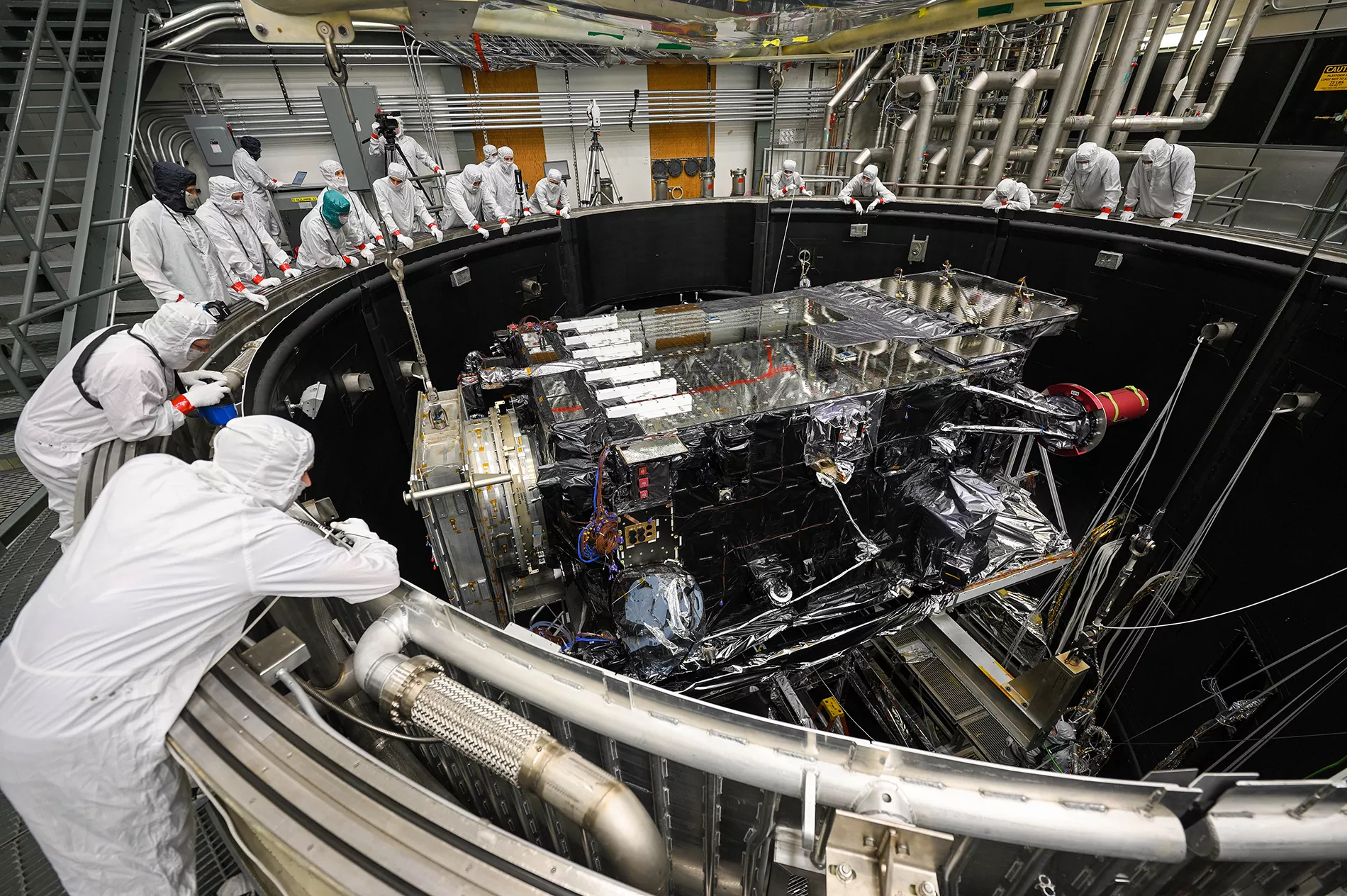 GOES-U is lowered into the thermal vacuum chamber.