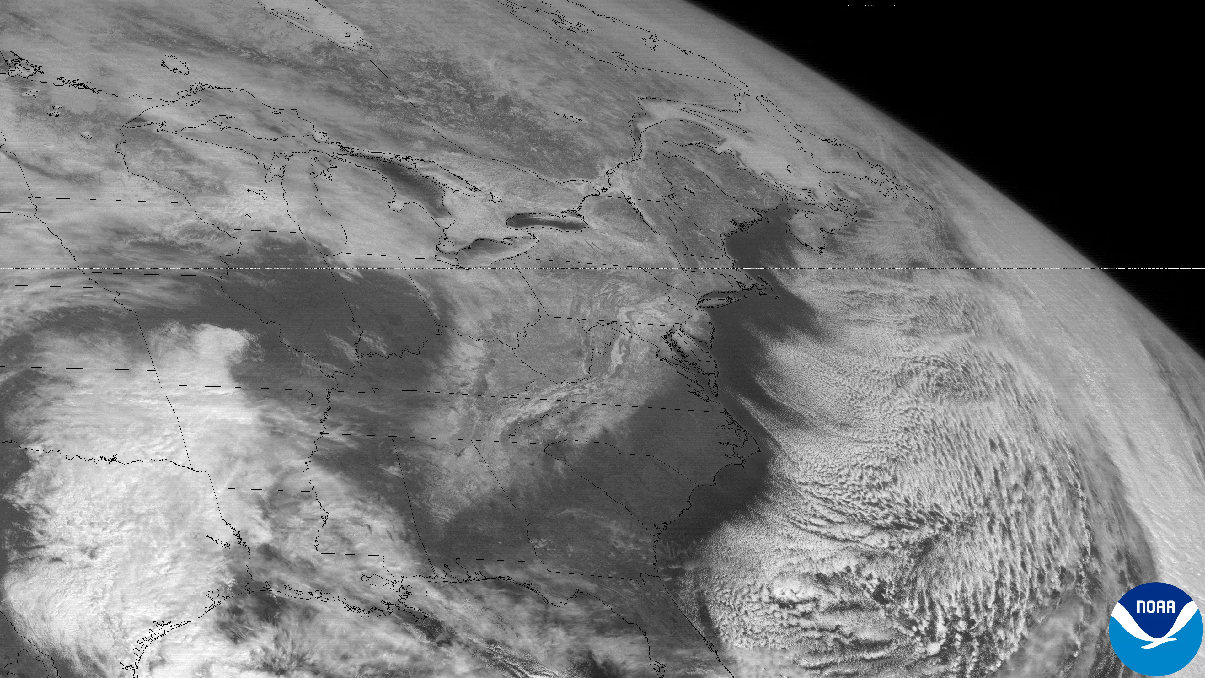 GOES-7 visible satellite image from March 14, 1993. In this image, the satellite is seeing the reflected sunlight off the snowfall that was dropped from the Deep South to New England. Also, “cloud streets” streaming off the Eastern Seaboard indicate the very cold air that poured in behind this massive storm.