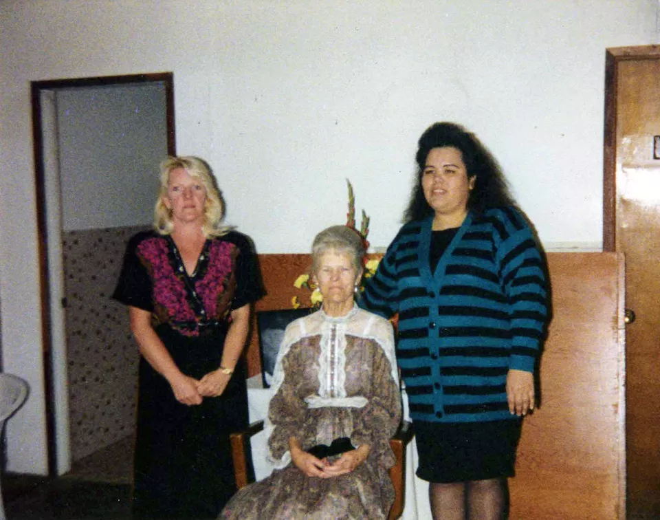 A photograph of Joseph's grandmother, Emma, as well as his Aunt Jill and mother. His grandmother is sitting in a chair between the two other women.