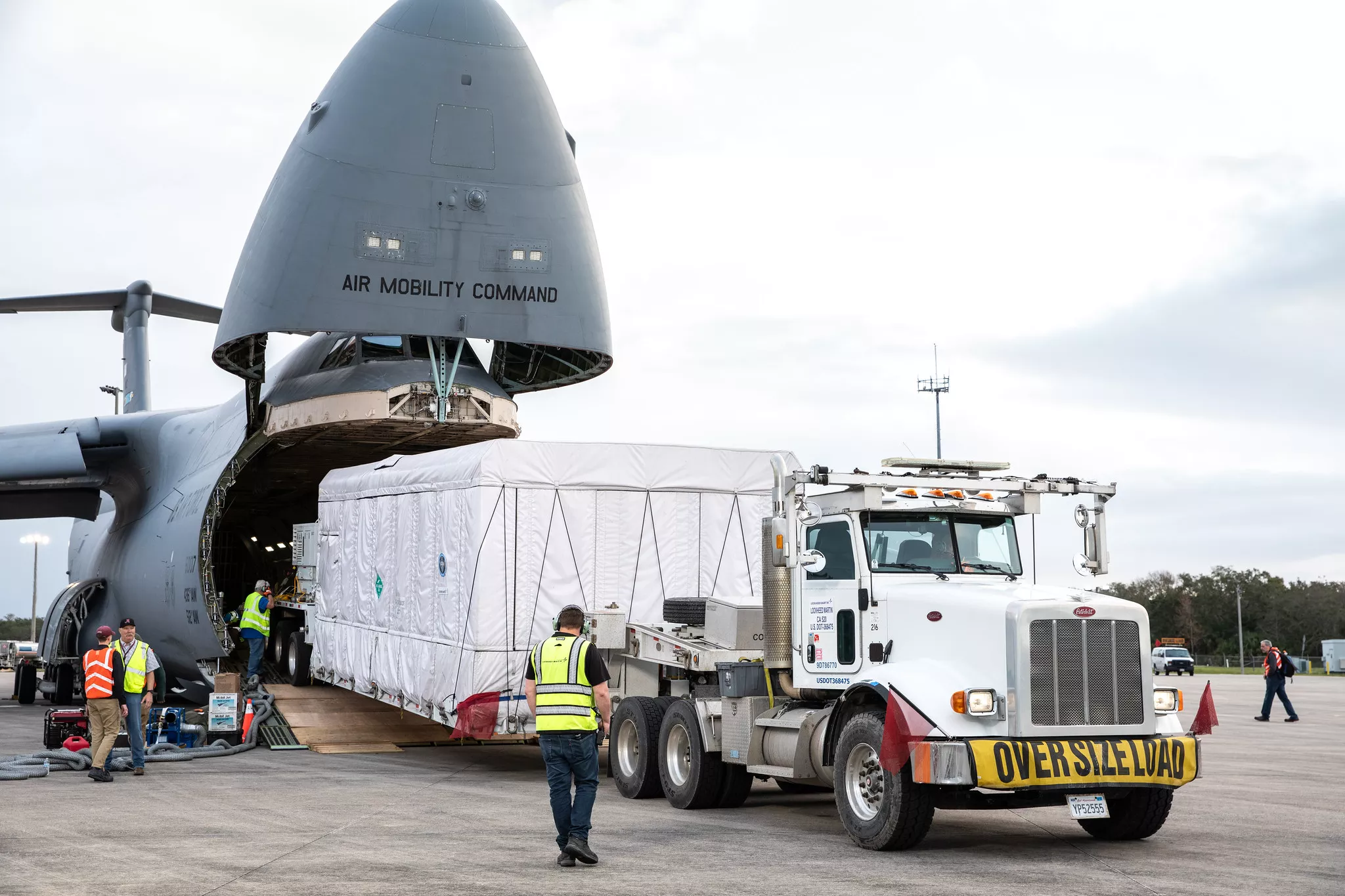 GOES-U is driven off the transport plane once it arrived at Kennedy Space Center