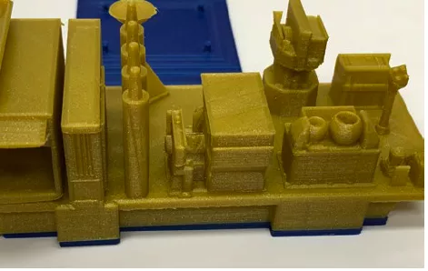 Photo of a zoomed in view of the 3D printed satellite bus and instruments.