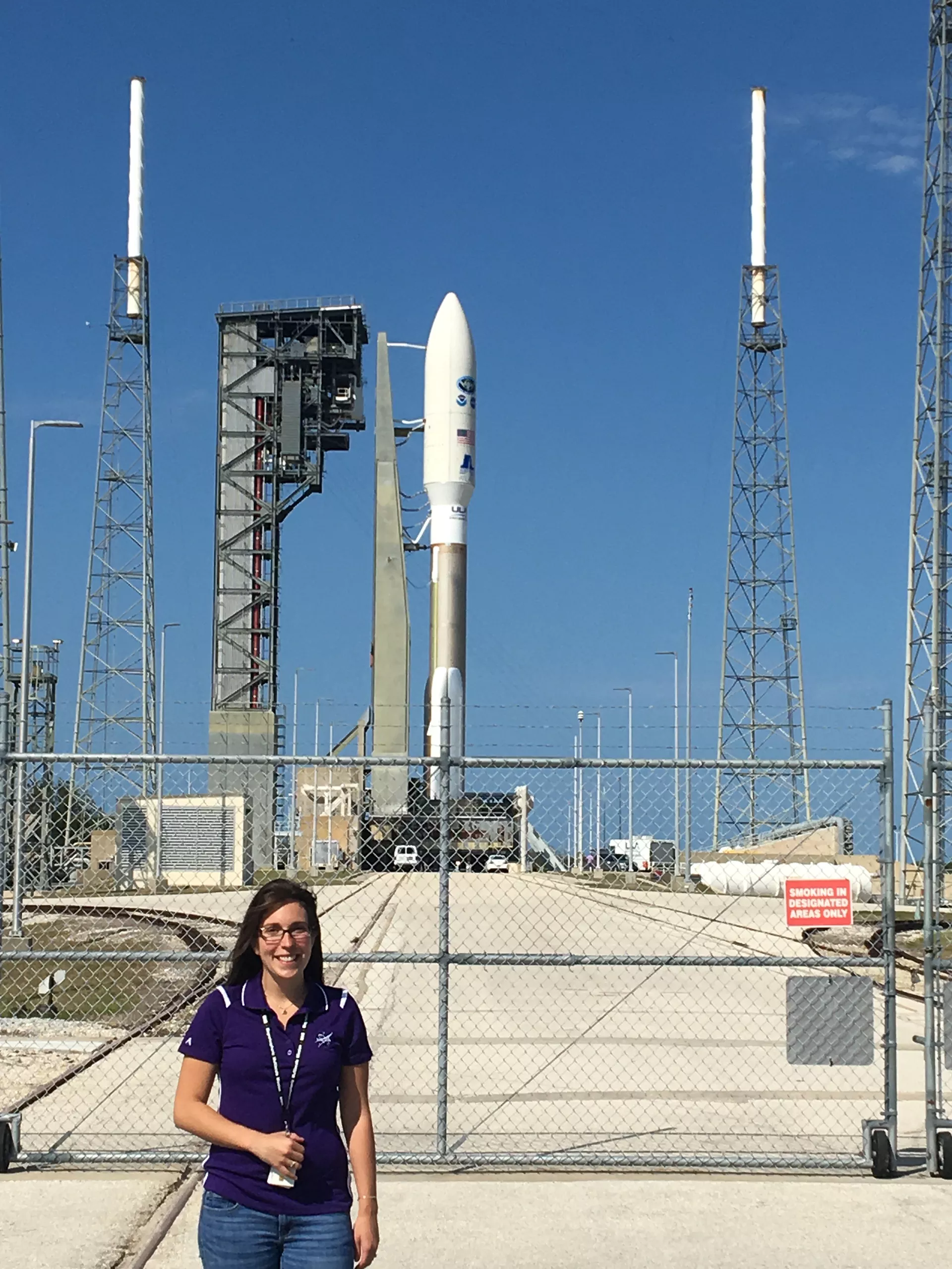Image of Michelle Rizzo in front of a spacecraft