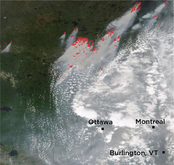 Satellite image of smoke and wildfire in Canada with Ottawa and Montreal labels.