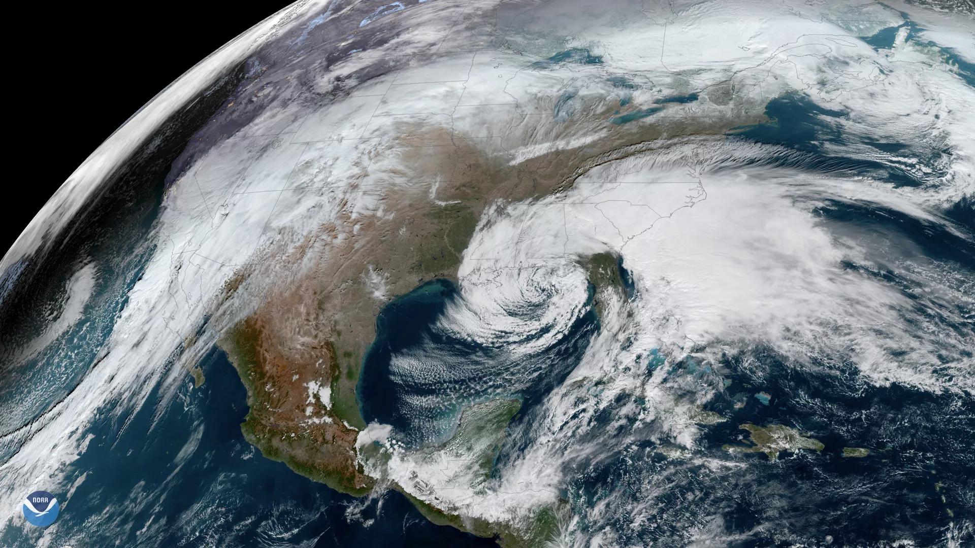 A low pressure system in the Southeast and heavy cloud cover in the West in this GeoColor GOES East imagery from Dec. 2019.