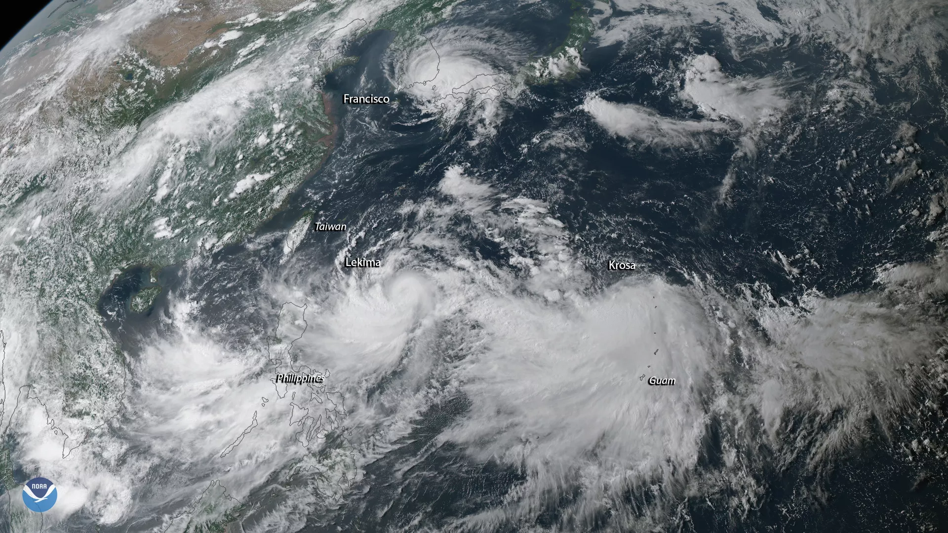 GeoColor imagery of a triangle of tropical storm systems (Lekima, Francisco, and Krosa) in the Western Pacific Ocean (Guam, Phillipines) via the Himawari-8 satellite August 6, 2019, 