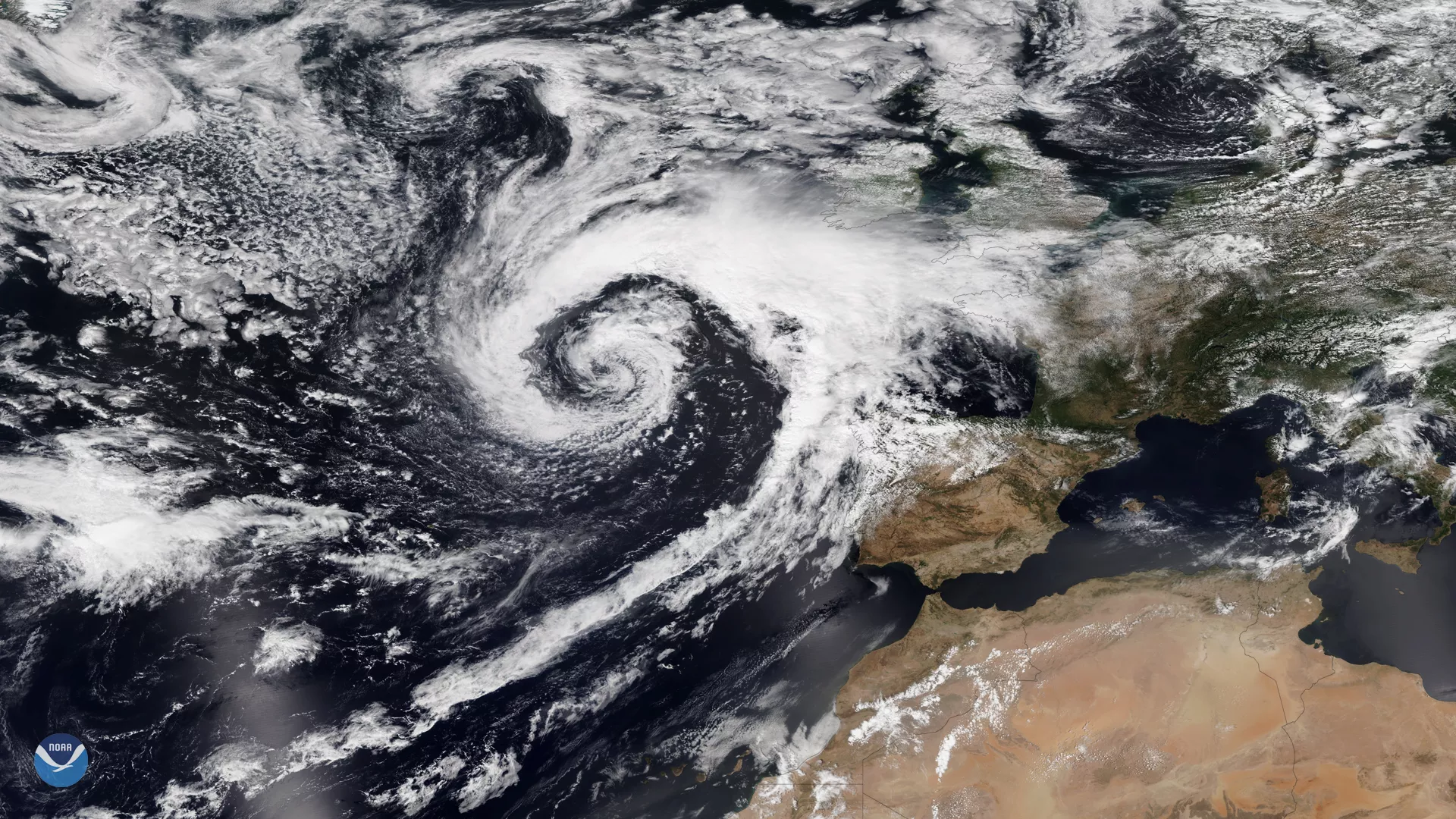 True Color imagery from the NOAA-20 satellite shows a powerful storm in the UK, as a low pressure system swirls off the coast.