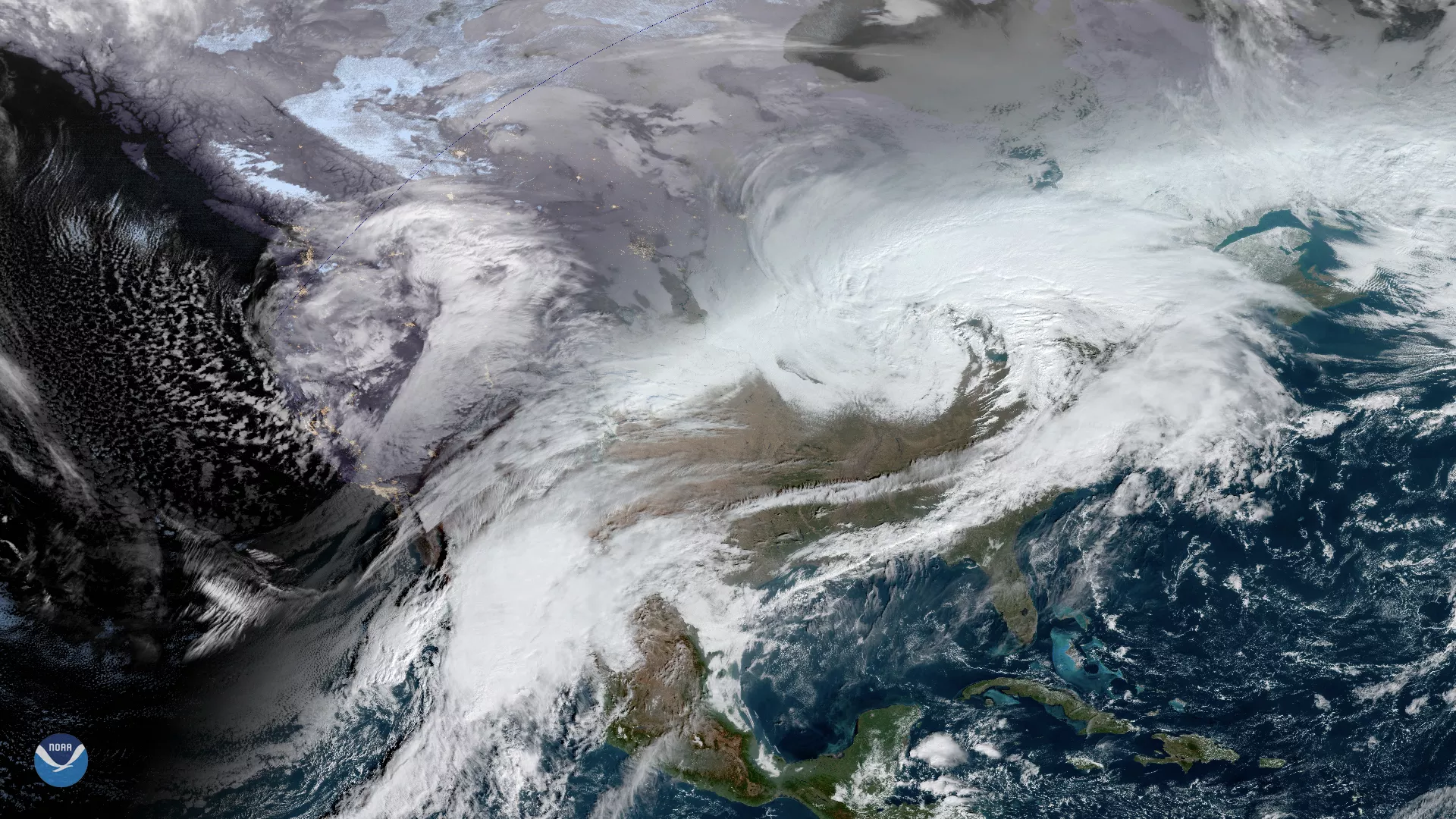 Merged GeoColor imagery of United States, showing storm fronts on both the East and West coasts, Dec. 2019. 