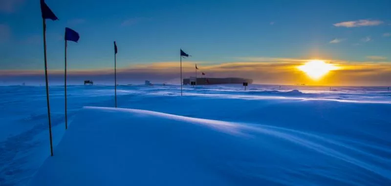 The National Science Foundation's Atmospheric Research Observatory illuminated by the Sun approaching South Pole sunset in 2014. 