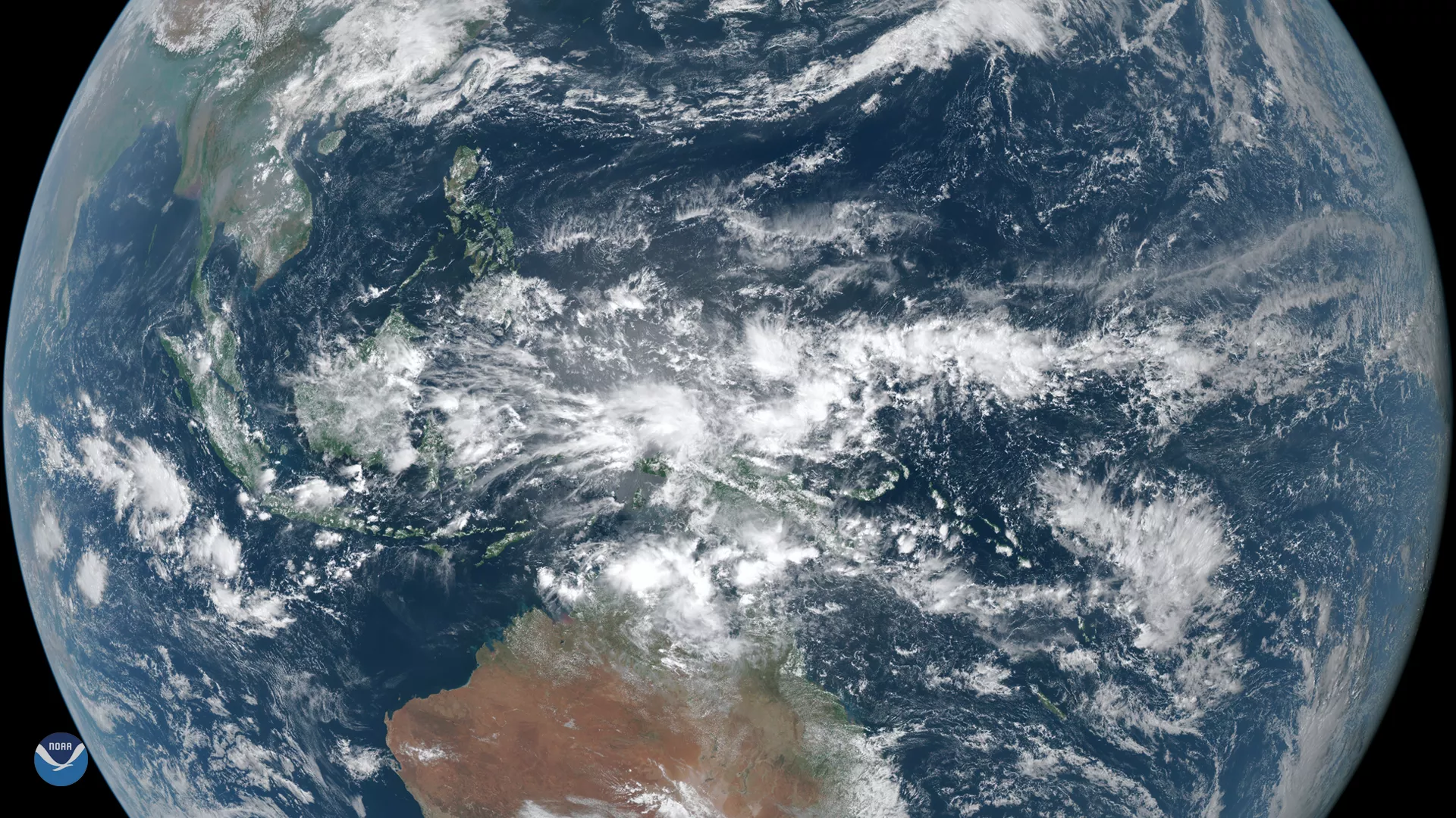 Full-disk GeoColor GOES East view of Pacific Ocean, Australia, and Southeast Asia, with Indonesia as the center point. 