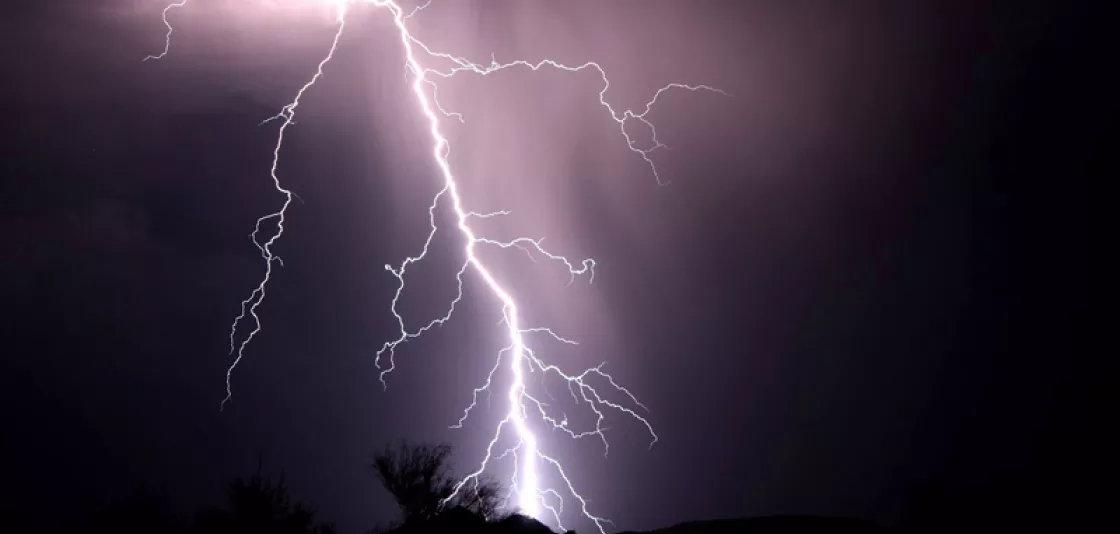 Photo of lightning over night landscape, taken by Paulina Cwik, NOAA. 