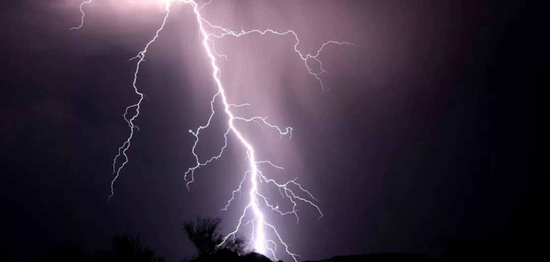 Photo of lightning over night landscape, taken by Paulina Cwik, NOAA.