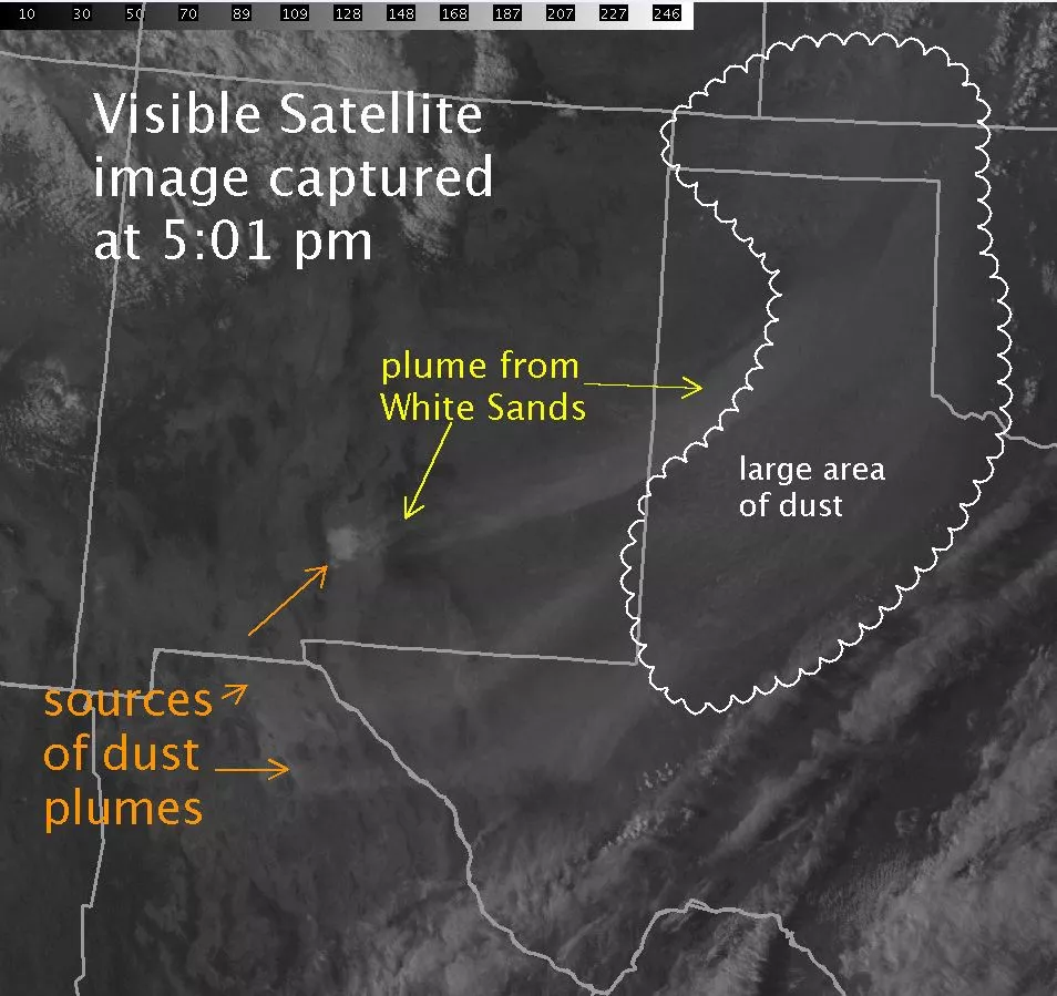 A black and white satellite image of New Mexico and Texas with indicators showing sources of dust plumes in southern New Mexico and Mexico, a plume of dust from White Sands, NM, and a large area of dust over northern Texas; a label at the top says, "Visible Satellite image captured at 5:01 pm"