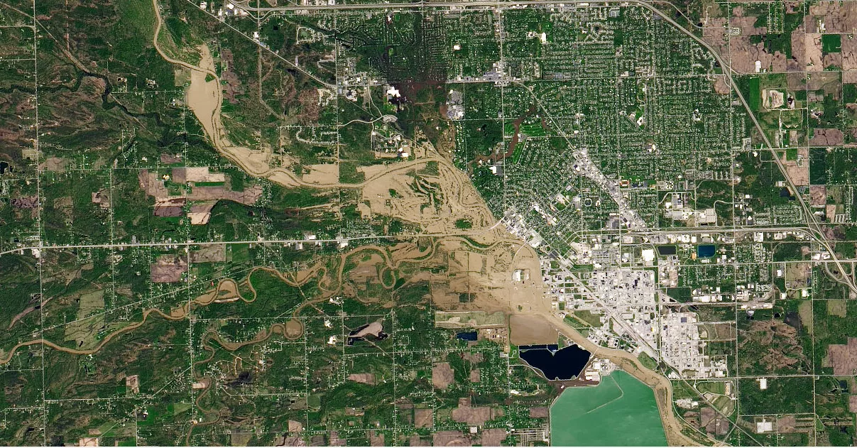 NASA Earth Observatory image of the flooding in Midland, Mich. (light brown areas), as seen from the U.S. Geological Survey satellite, Landsat. 